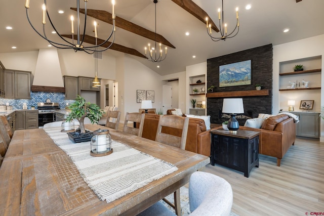 dining area with vaulted ceiling with beams, built in features, light wood-type flooring, and a fireplace