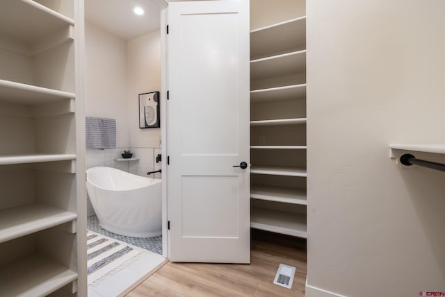 bathroom with wood-type flooring