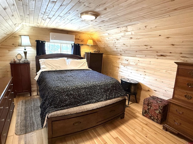 bedroom featuring wooden ceiling, wooden walls, light hardwood / wood-style floors, and lofted ceiling