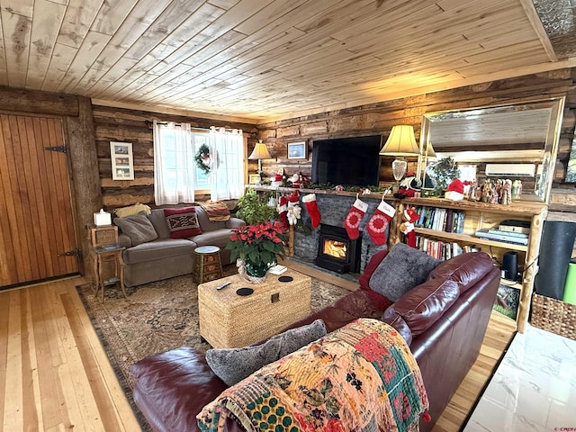 living room with wood ceiling, light wood-type flooring, and wooden walls