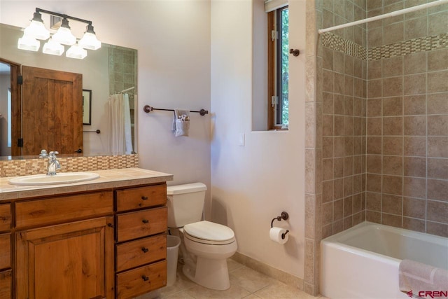 full bathroom featuring tile patterned flooring, vanity, toilet, and shower / bathtub combination with curtain