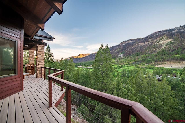 wooden terrace with a mountain view