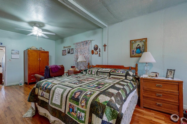 bedroom with ceiling fan and light wood-type flooring