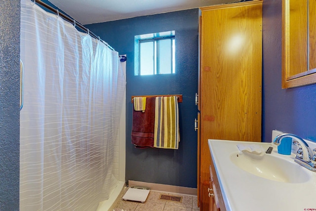 bathroom with tile patterned flooring, vanity, and a shower with shower curtain