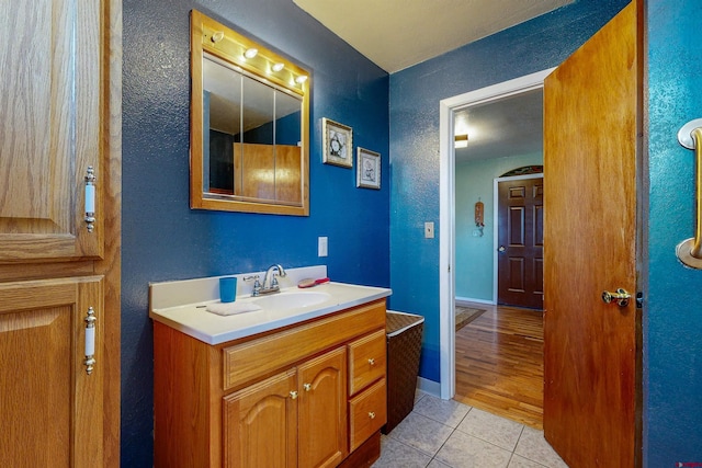 bathroom with vanity and wood-type flooring