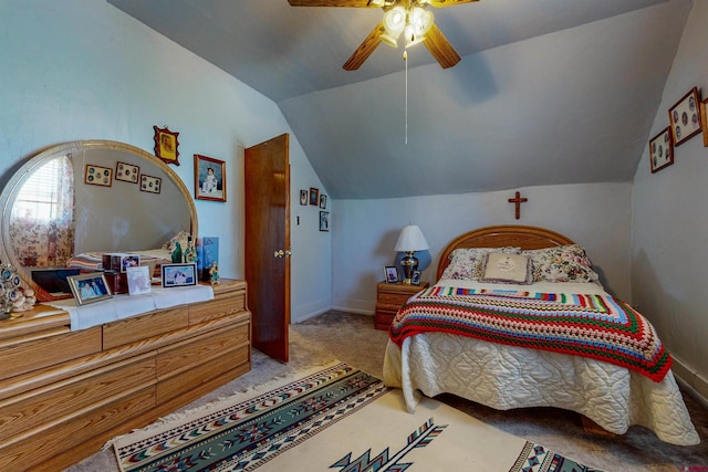 carpeted bedroom with ceiling fan and lofted ceiling