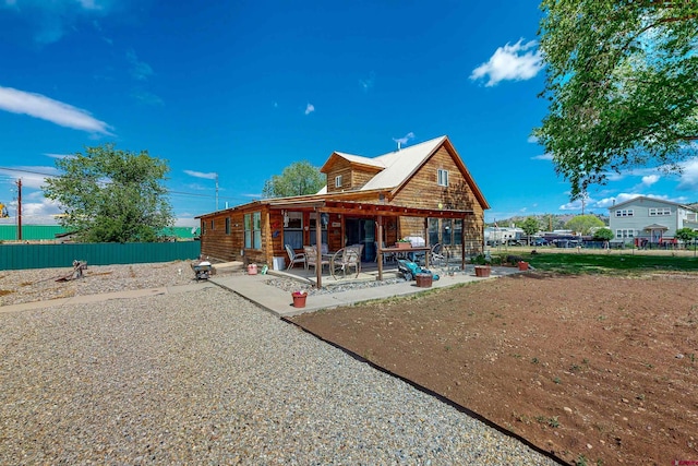 back of house featuring a patio area