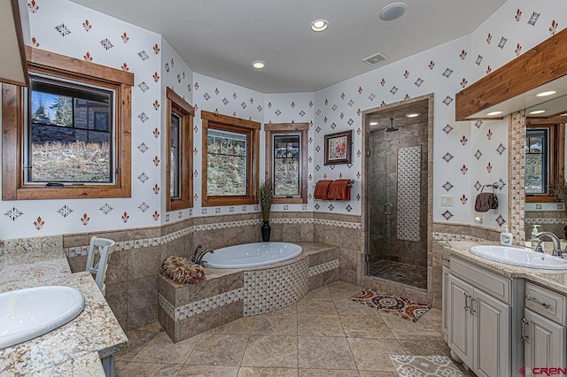 bathroom with vanity, tile patterned floors, and independent shower and bath