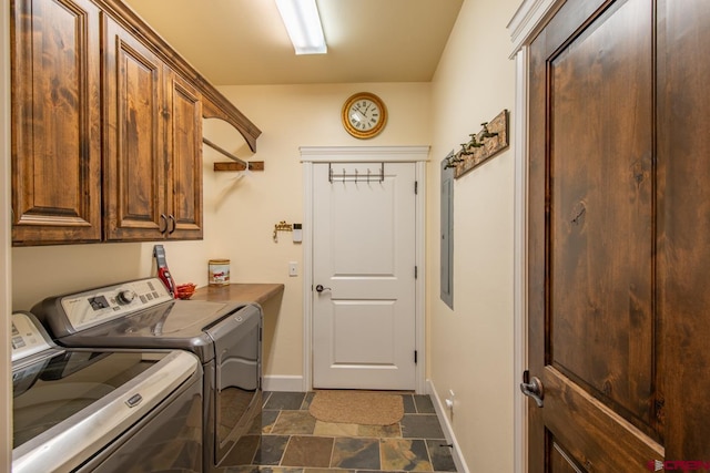 washroom with washer and clothes dryer and cabinets