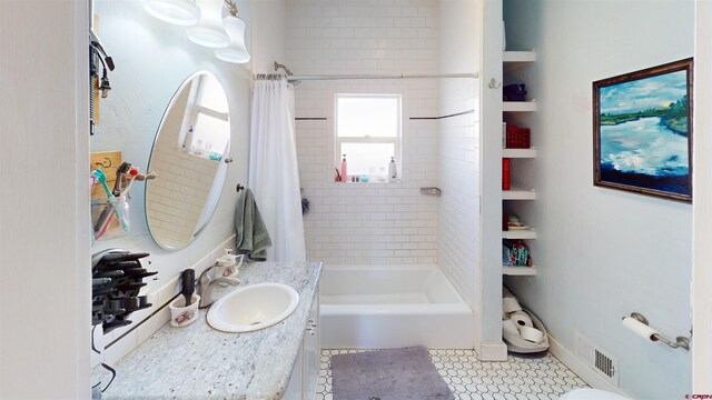 bathroom featuring shower / bath combo with shower curtain, vanity, and tile patterned flooring