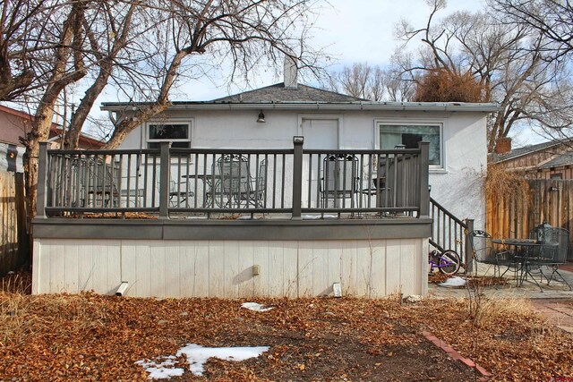 back of house with a wooden deck