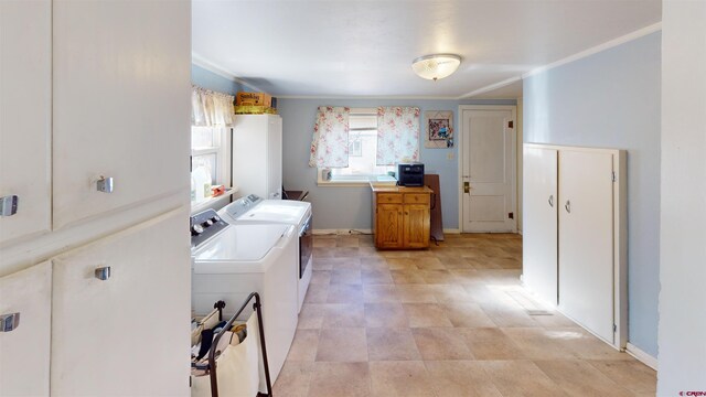 clothes washing area featuring washing machine and dryer