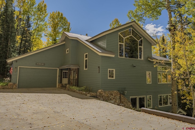 view of property exterior featuring a garage