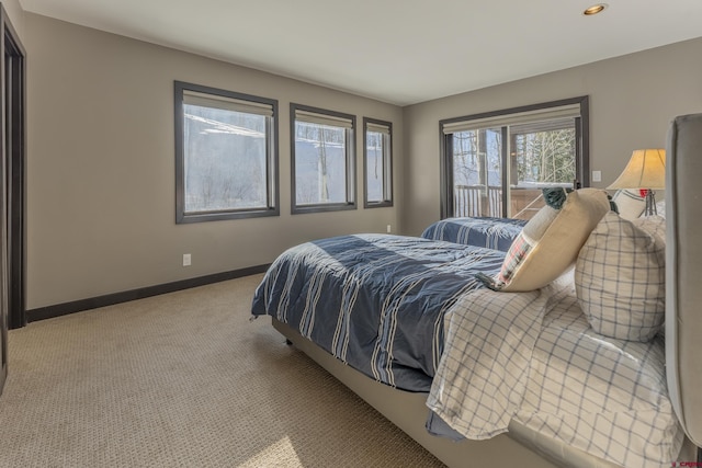 bedroom featuring light carpet