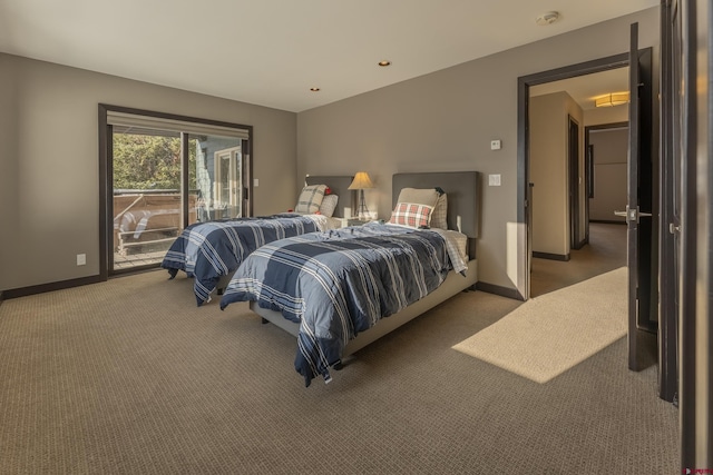 carpeted bedroom with access to exterior