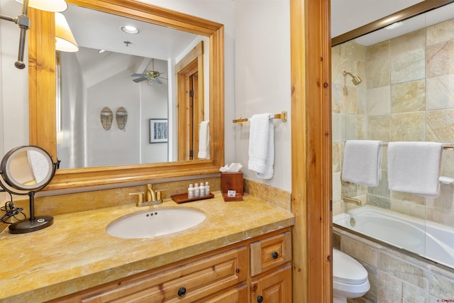 full bathroom featuring combined bath / shower with glass door, vanity, toilet, and ceiling fan