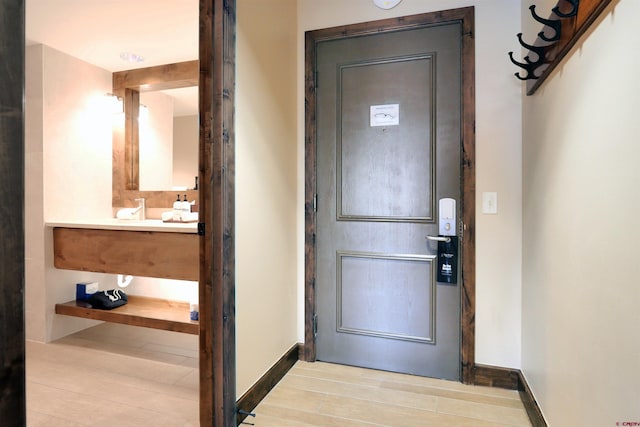 entryway with light hardwood / wood-style flooring