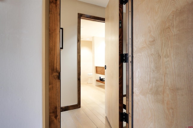 corridor featuring light hardwood / wood-style floors