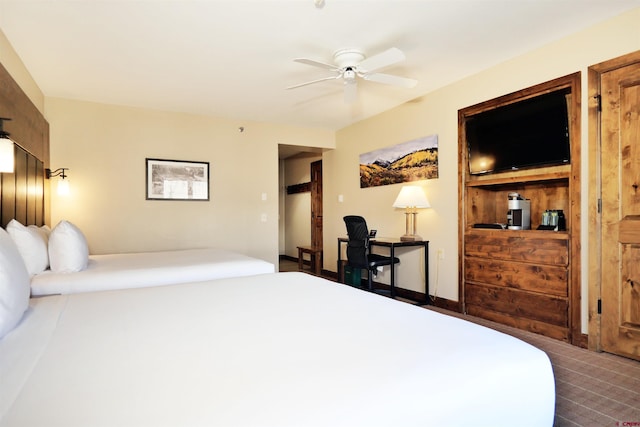 carpeted bedroom featuring ceiling fan