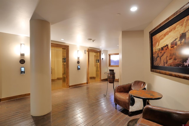 living area with wood-type flooring