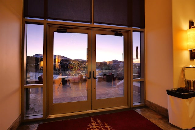 doorway to outside with a mountain view and french doors