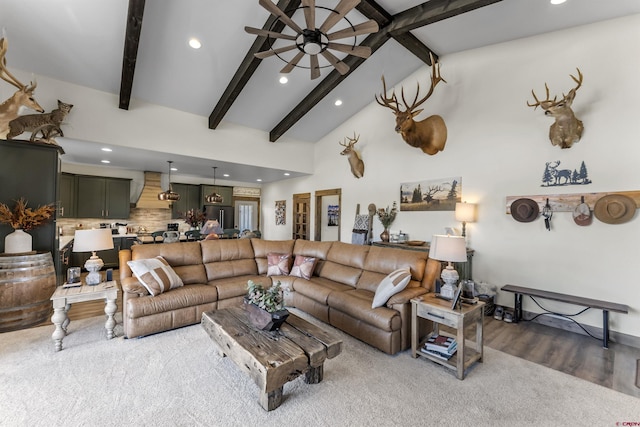 living room with beam ceiling, ceiling fan, and high vaulted ceiling