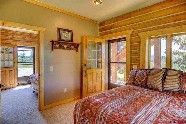 carpeted bedroom with log walls