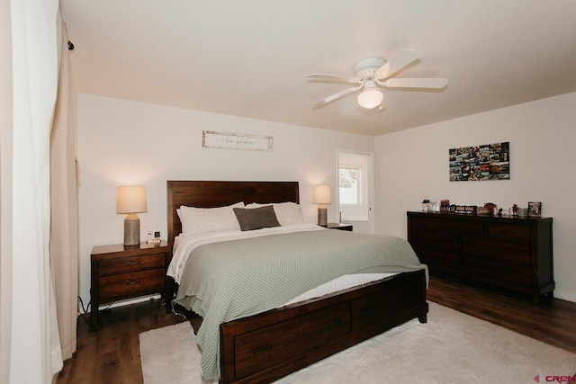 bedroom featuring ceiling fan and dark hardwood / wood-style flooring