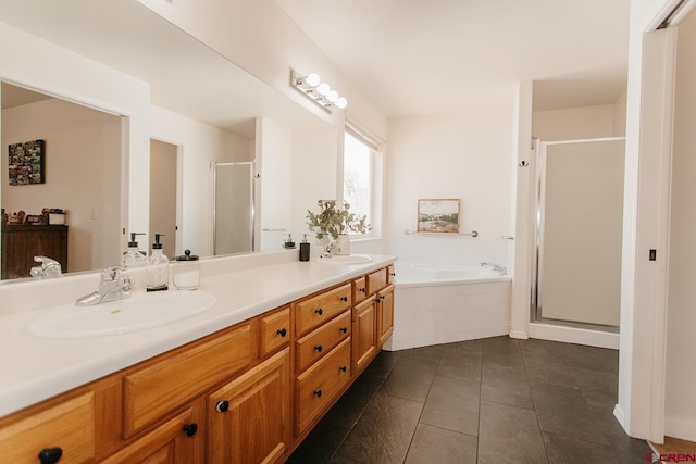 bathroom with tile patterned flooring, vanity, and independent shower and bath