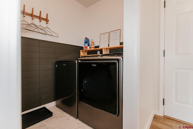 washroom featuring washer and clothes dryer