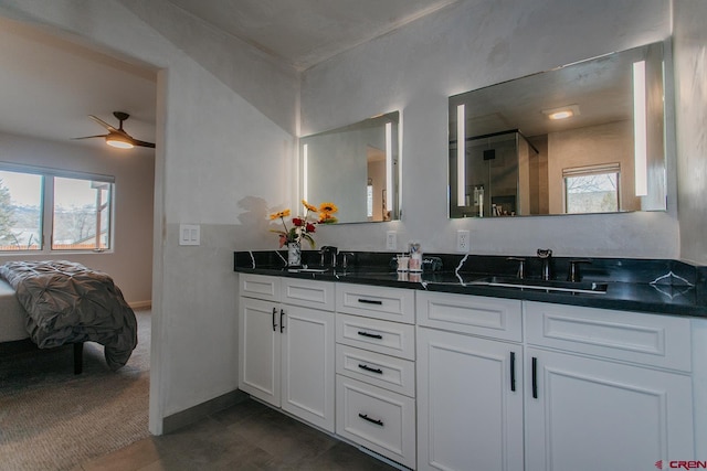 bathroom with ceiling fan, plenty of natural light, vanity, and tile patterned flooring