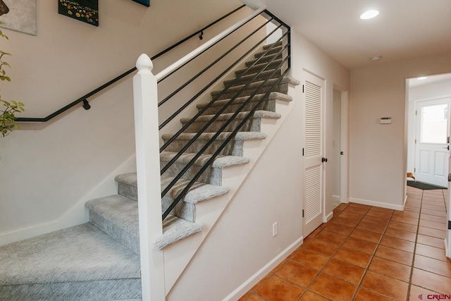 stairway featuring tile patterned floors