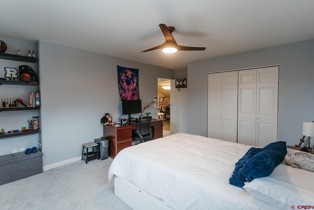 carpeted bedroom featuring a closet and ceiling fan