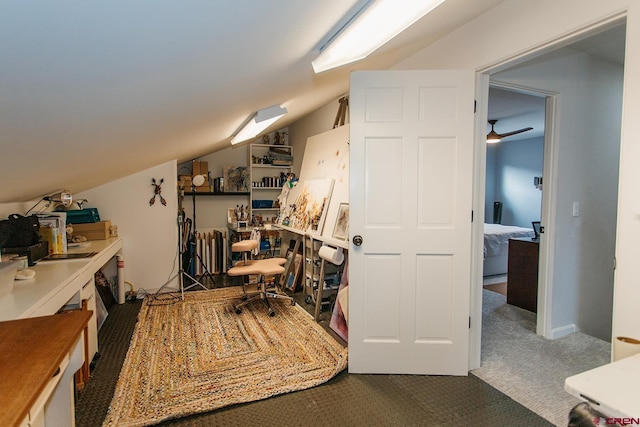 office featuring carpet flooring, vaulted ceiling, and ceiling fan