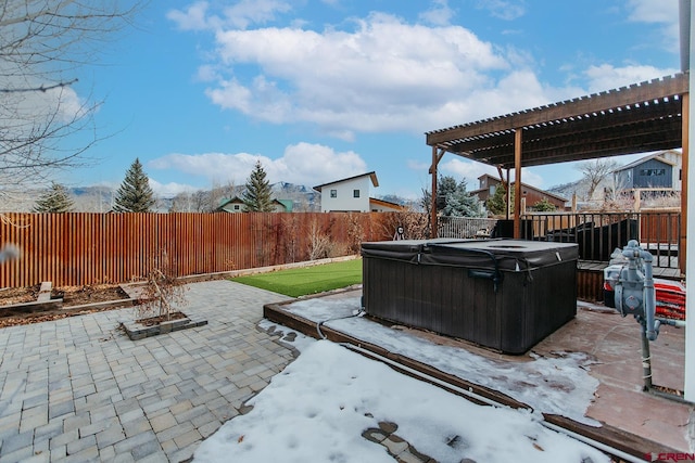 view of patio / terrace featuring a pergola and a hot tub