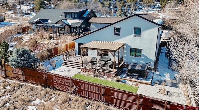 rear view of house featuring a deck