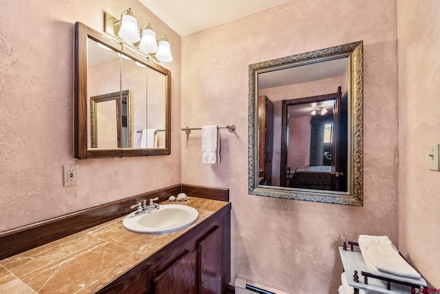 bathroom with vanity and a baseboard radiator