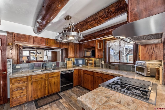 kitchen with sink, black appliances, beam ceiling, pendant lighting, and range hood