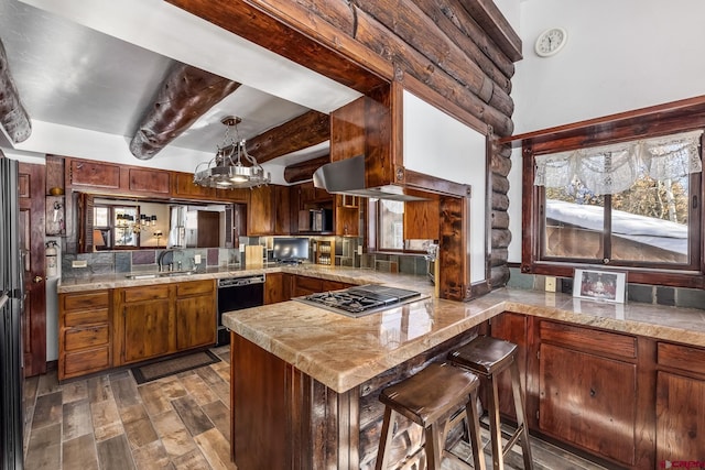 kitchen featuring beam ceiling, rustic walls, dishwasher, sink, and kitchen peninsula