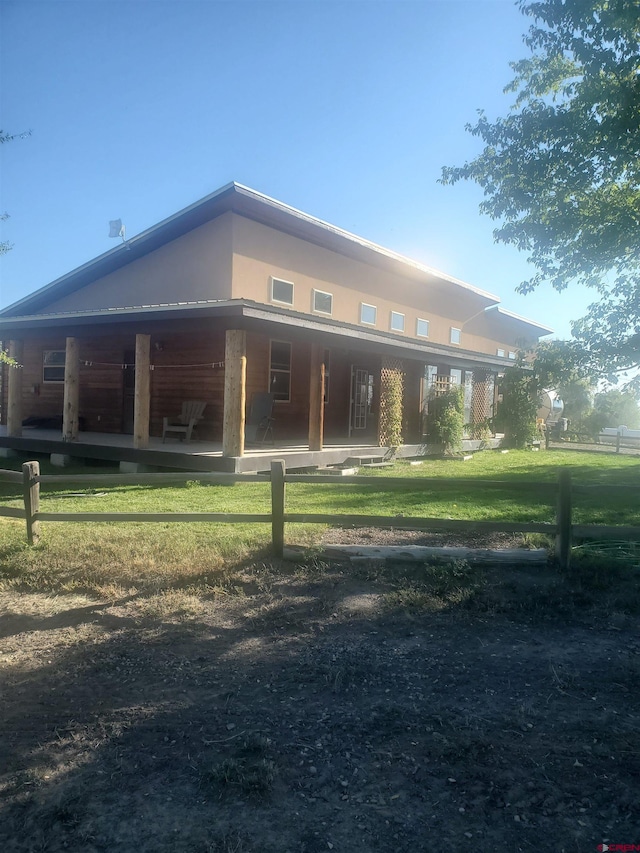 rear view of house with a lawn