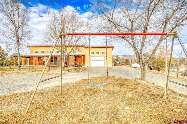 view of front facade featuring a mountain view and a garage