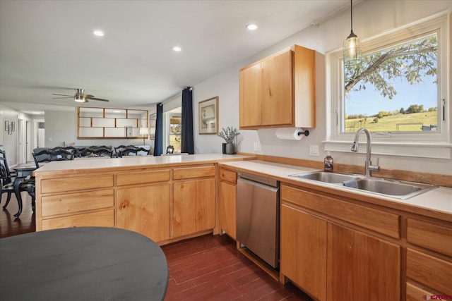 kitchen with pendant lighting, sink, stainless steel dishwasher, ceiling fan, and kitchen peninsula