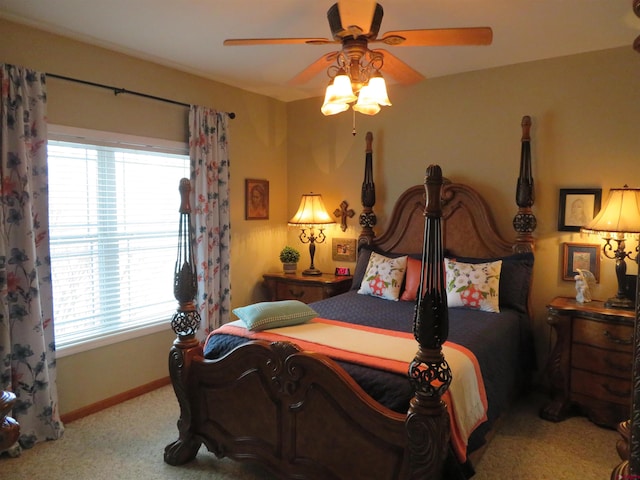 bedroom with ceiling fan and carpet