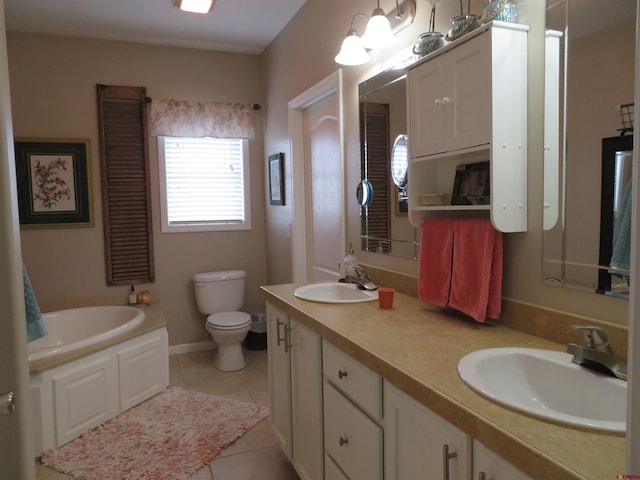 bathroom featuring tile patterned floors, vanity, toilet, and a tub to relax in