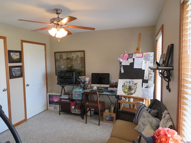 office area featuring ceiling fan and light carpet