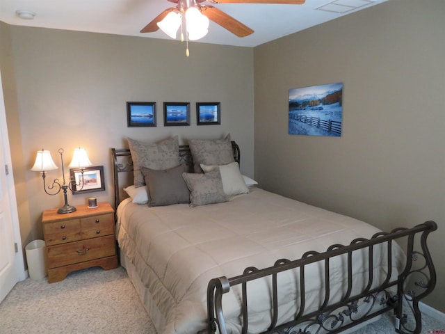 bedroom with ceiling fan and light colored carpet