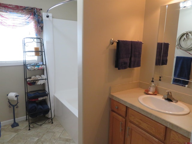 bathroom featuring shower / bathing tub combination and vanity