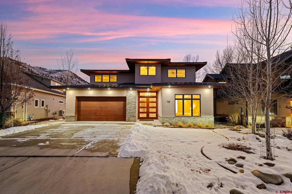 prairie-style home featuring a garage