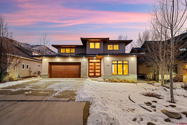 prairie-style home featuring a garage