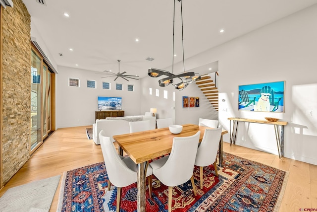 dining room with light hardwood / wood-style flooring and ceiling fan